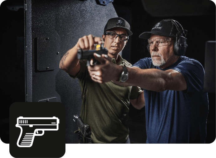 Firearms intsructor helping out student