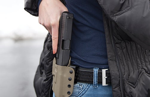 Concealed Carry Woman drawing firearm