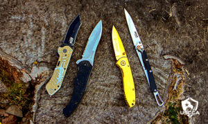 Reviewed budget knives from left to right: S&W MP2BD, Kershaw 1940ST, S&W Executive Gold Frame, Bear & Son Minimal