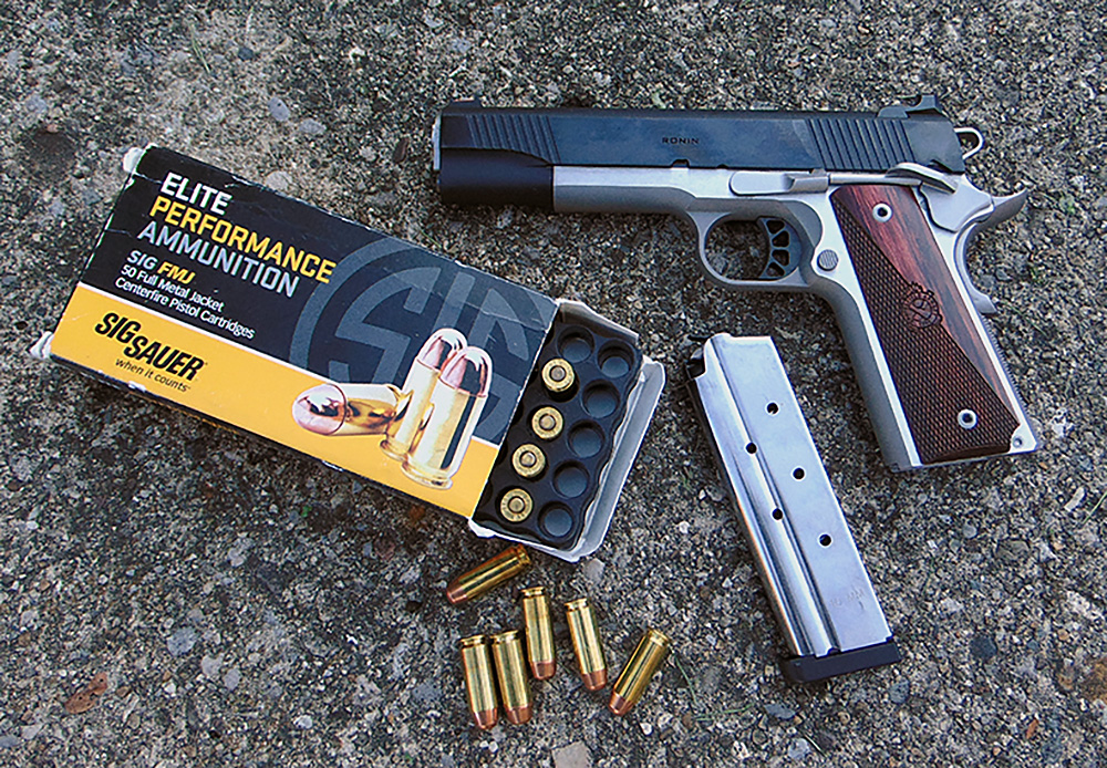 10mm Auto pistol and ammunition pictured to illustrate early development and intended defensive role
