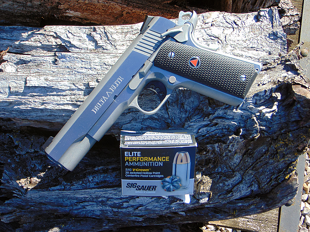 Modern 10mm Auto handgun and ammunition shown to represent the cartridge’s resurgence for civilian and woods defense