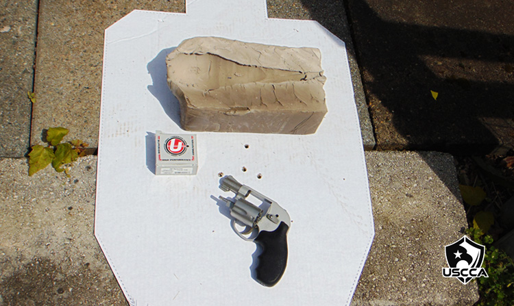 The clay block results from the Underwood Black Cherry Ammo on top of the silhouette target with the Smith & Wesson Bodyguard 638.