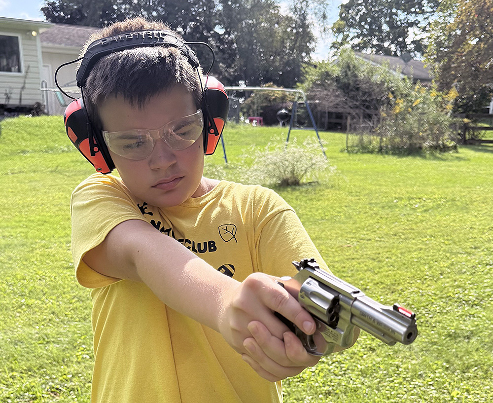 a 12-year-old shoots the .22 Model 63 Kit Gun from Smith & Wesson.